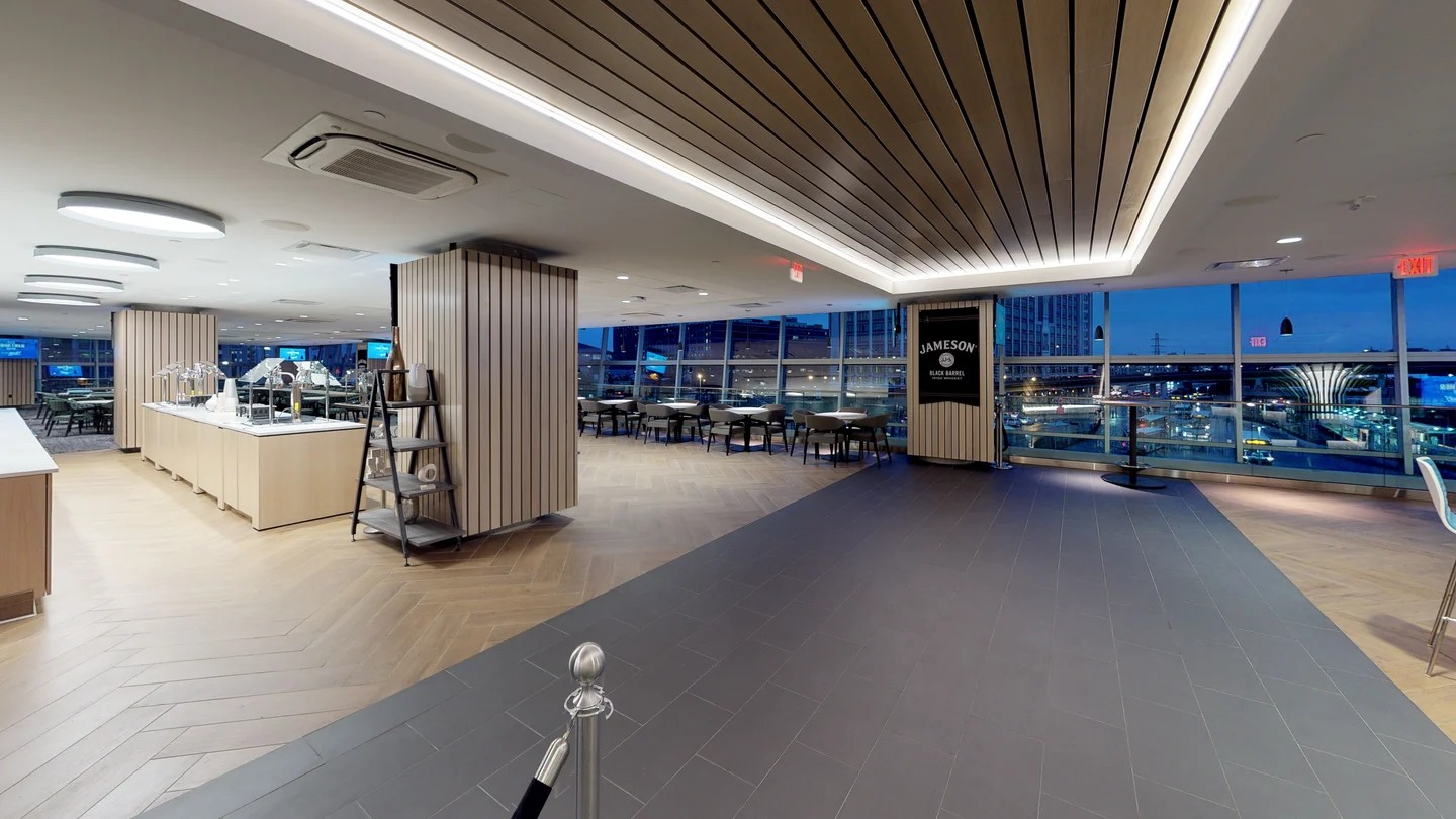 Jameson Club at Clark Avenue, the club concourse, with the black barrel column marking the entry. co-designed