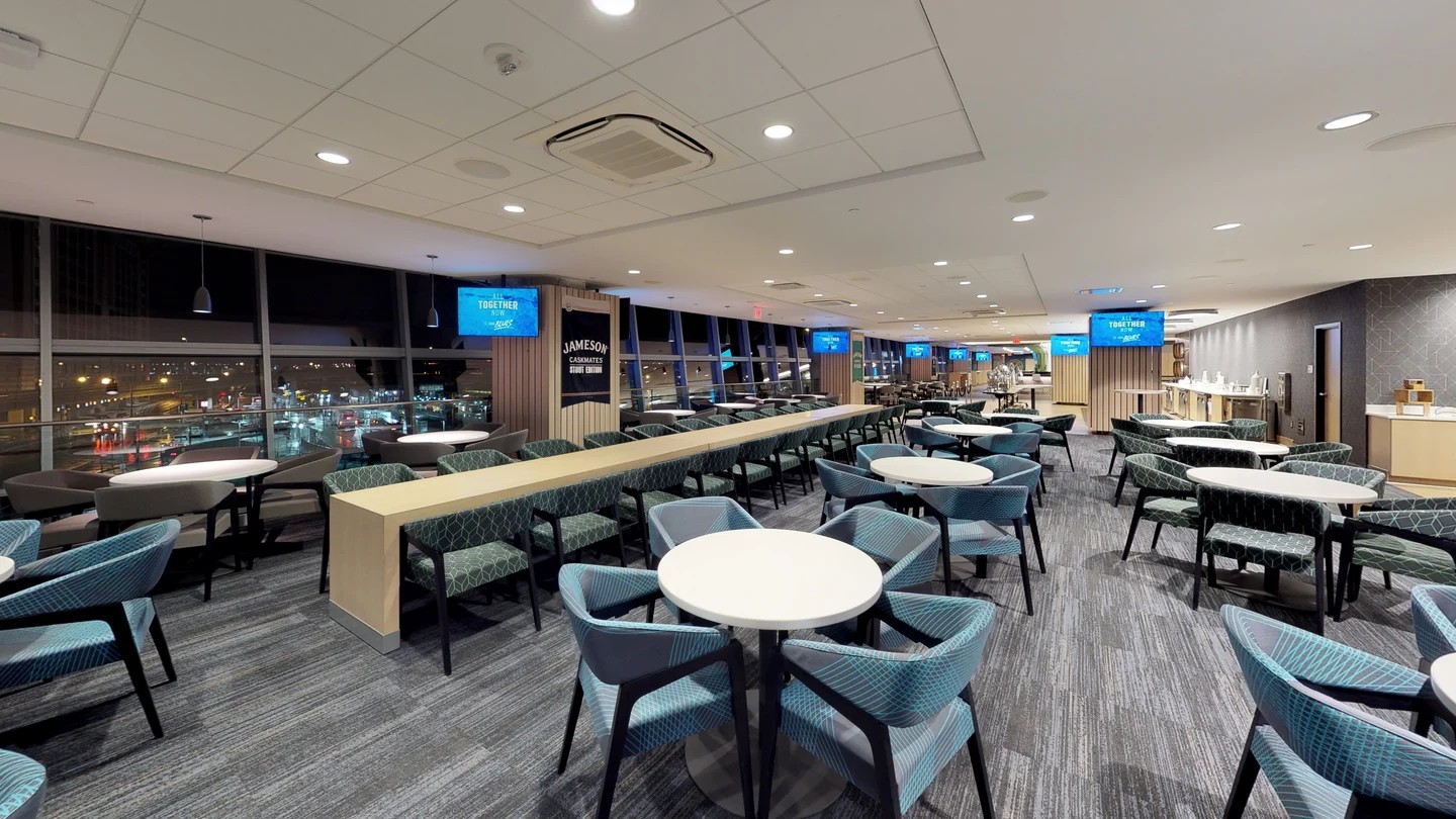 Jameson Club at Clark Avenue, the caskmates lounge and communal table along the window line. co-designed